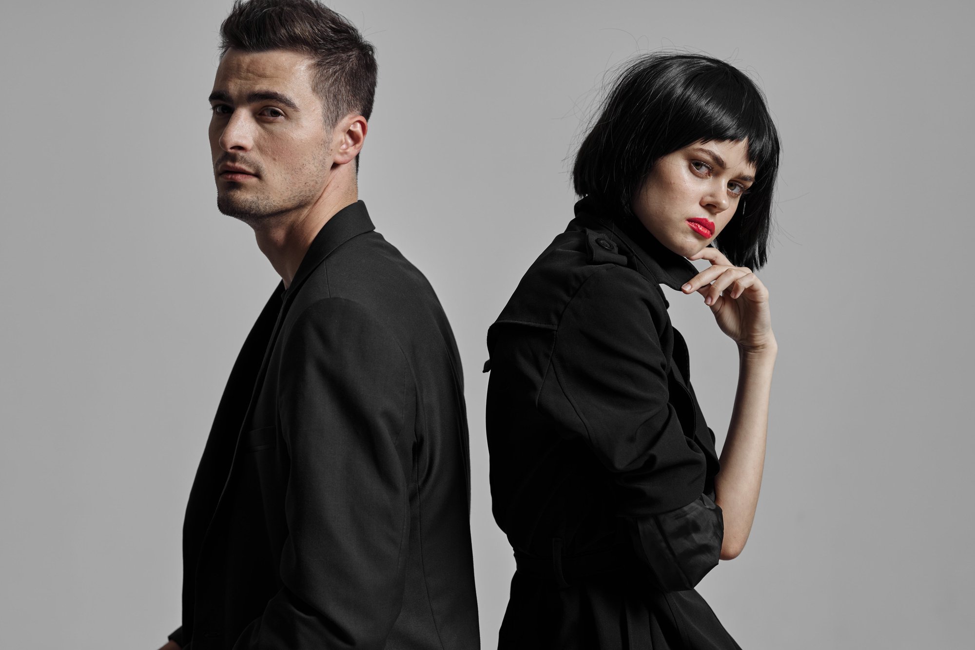 Male and Female Models Wearing an All Black Outfit